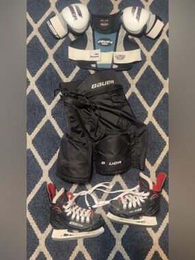 Bauer youth large Hockey Pants, youth large shoulder pads and Y11 skates.